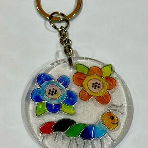 Floral caterpillar round 2.5 inch acrylic keychain